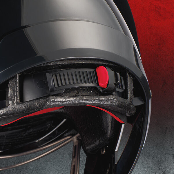 Close-up of the inside of a black helmet showing an adjustable strap with a red slider against a gradient red and gray background.
