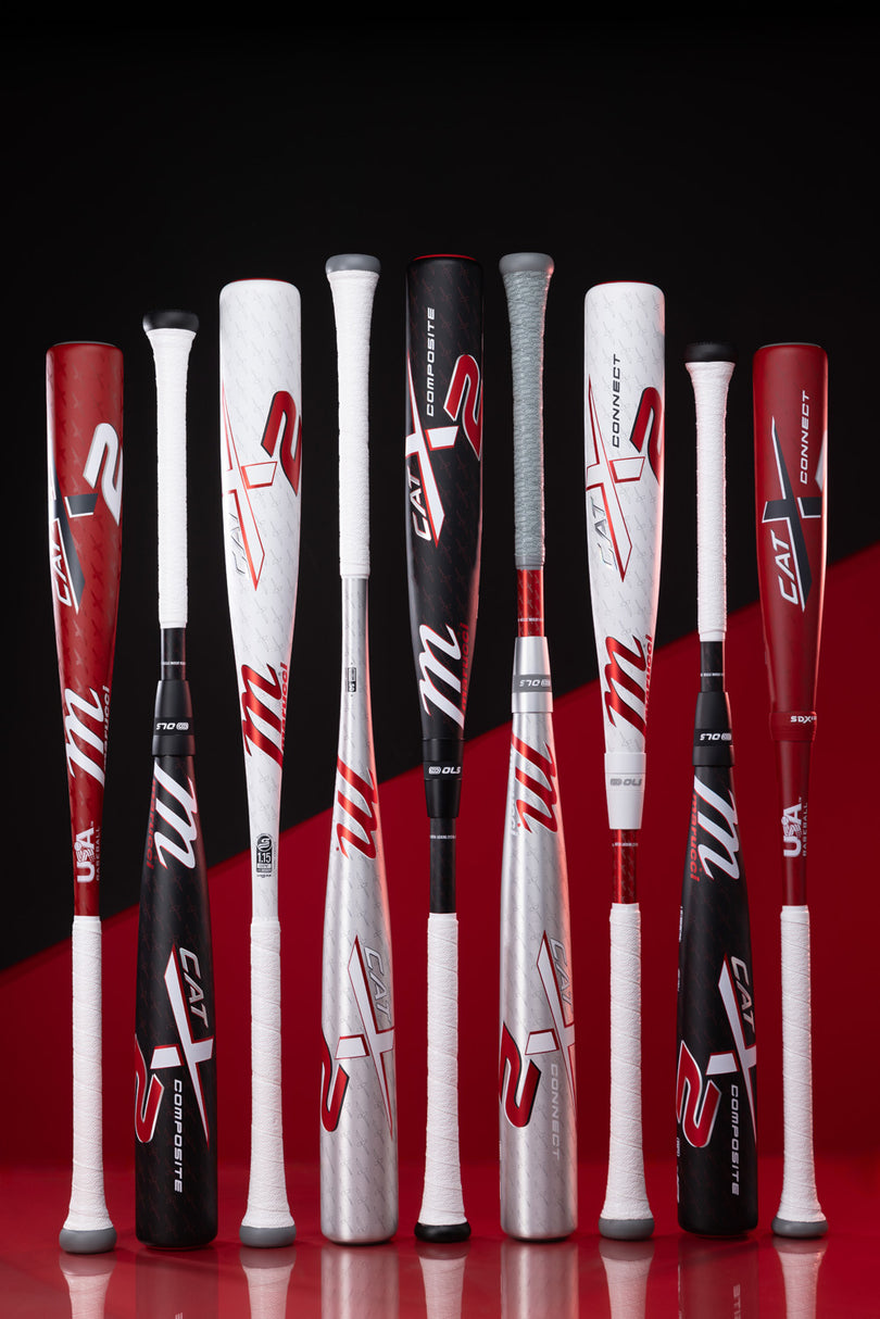 Eight Marucci BBCOR bats, including the 2025 Marucci CATX2 Connect (-3) BBCOR Baseball Bat (MCBCCX2) with anti-vibration tech, stand upright in red, black, white, and silver on a striking red and black background.