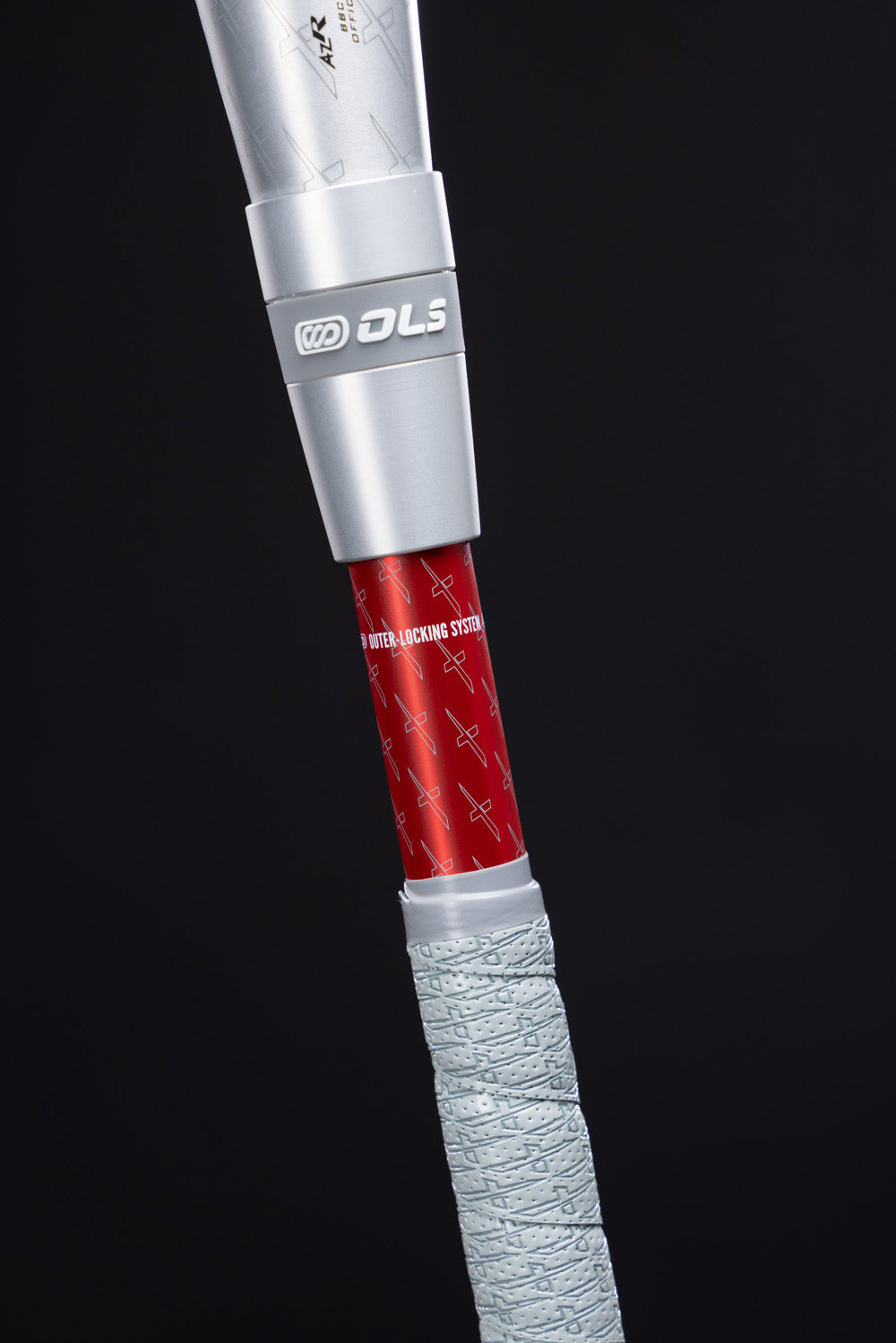Close-up of the 2025 Marucci CATX2 Connect (-3) BBCOR Baseball Bat handle, showing anti-vibration tech on its textured light gray grip, a red WATER-LOCKING STEM, and metallic silver connectors—all by Marucci, against a black background.