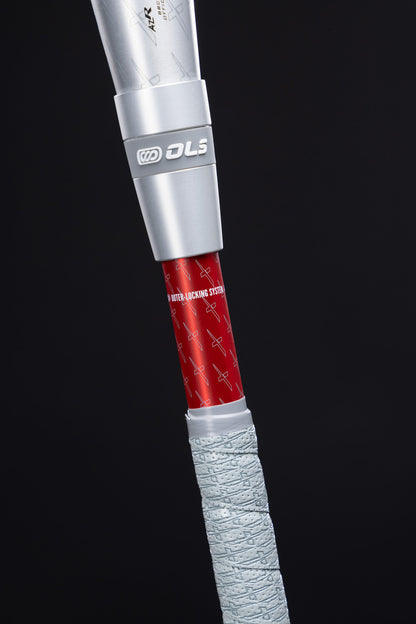Close-up of the 2025 Marucci CATX2 Connect (-3) BBCOR Baseball Bat handle, showing anti-vibration tech on its textured light gray grip, a red WATER-LOCKING STEM, and metallic silver connectors—all by Marucci, against a black background.