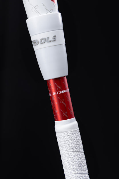 Close-up of a Marucci 2025 CATX2 Connect (-10) USSSA Baseball Bat handle with white grip tape and a branded attachment featuring anti-vibration technology, set against a black background.
