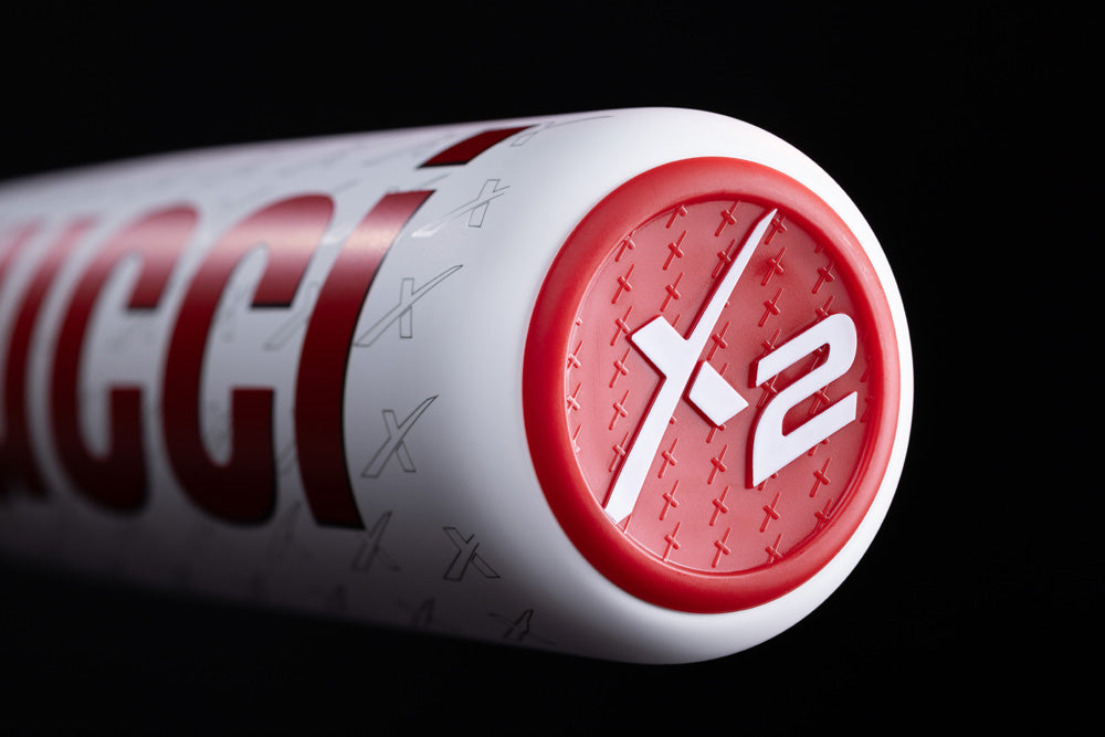 Close-up of the end cap on the Marucci 2025 CATX2 Connect (-10) 2 3/4" USSSA Baseball Bat (MSBCCX210 DEMO), showing a red circular design with white "X2" and a pattern of small X shapes on the cap.