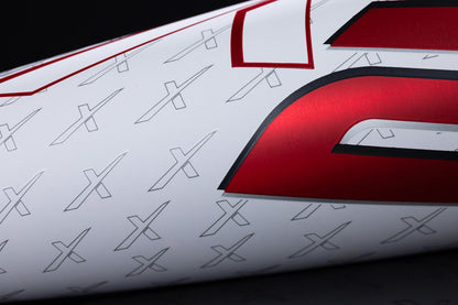 Close-up of a white surface with a red metallic number and small gray X patterns, echoing the Marucci 2025 CATX2 (-10) USSSA bat’s one-piece alloy build and anti-vibration technology.