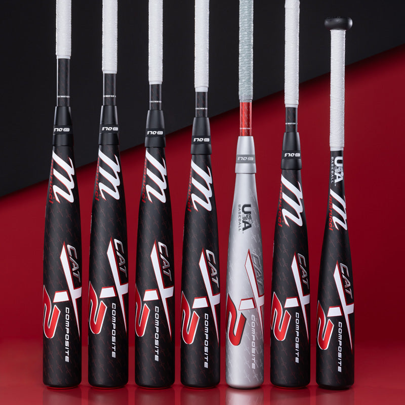 Six black and red baseball bats and one silver and red bat are standing upright in a row against a red and black background. The bats are labeled CAT X and have wrapped handles.