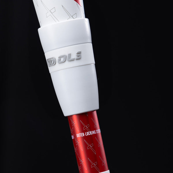Close-up of a red and white shaft with a white plastic locking mechanism labeled DLS and Outer-Locking System on a dark background.