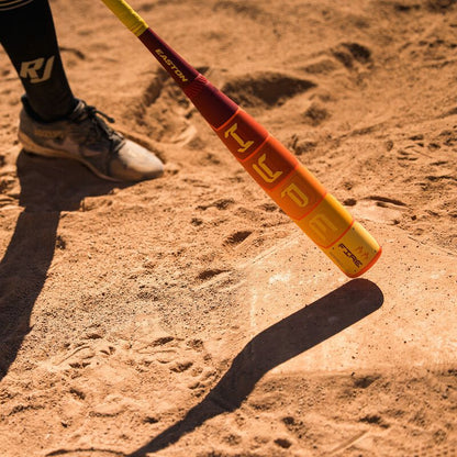 A person holding the 2025 Easton Hype Fire (-8) 2 3/4" USSSA Baseball Bat (EUT5HYP8), featuring Power Boost Soft Knob and advanced Thermo-Composite technology.