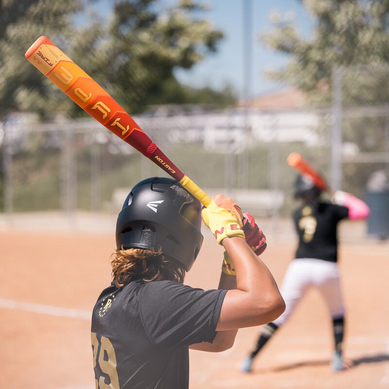 A person holding the 2025 Easton Hype Fire (-8) USSSA Baseball Bat, featuring advanced Thermo-Composite technology for powerful hits.
