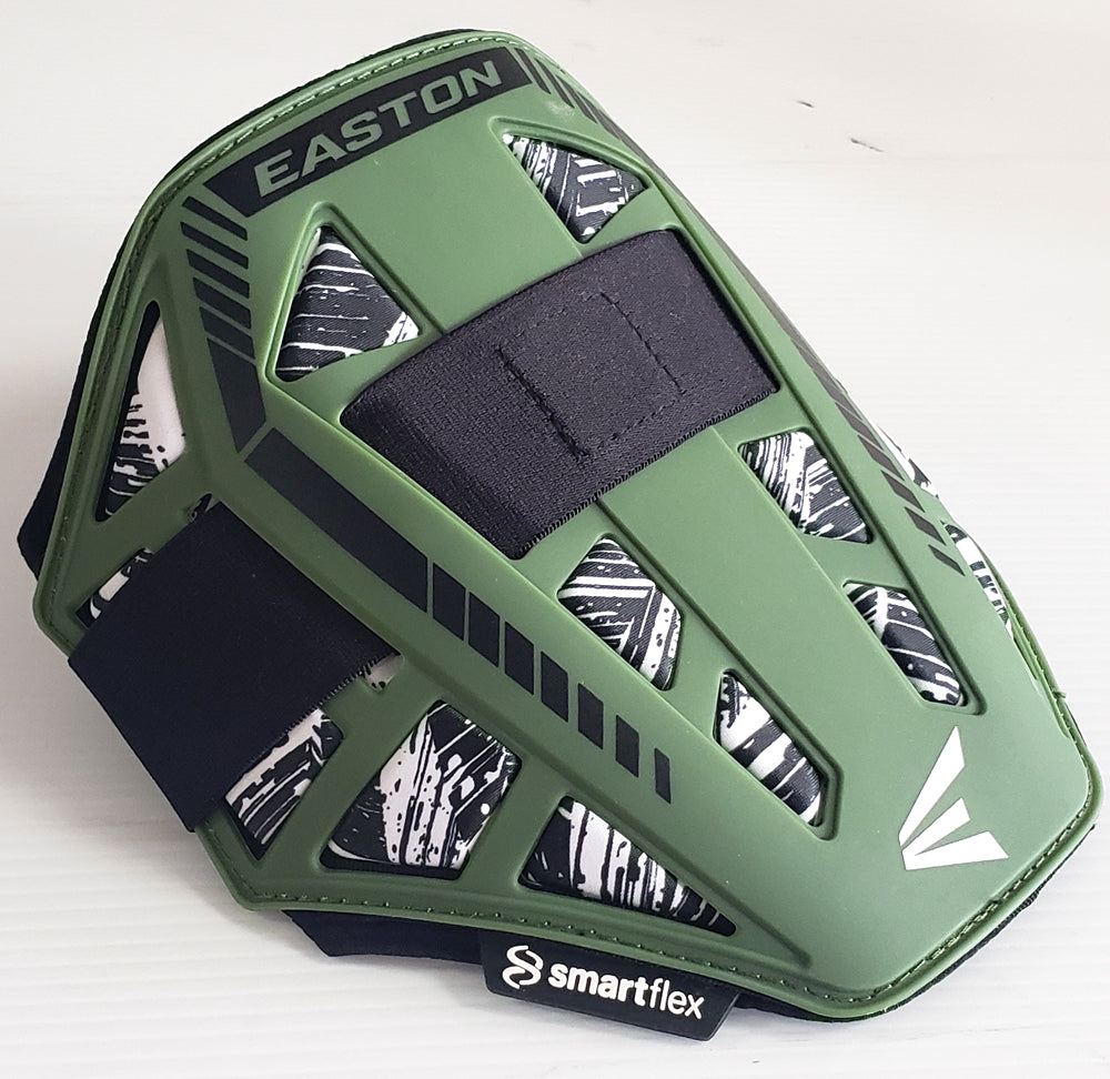 The Easton Compact Batter Elbow Guard: ES37 features a green exterior, black and white patterned inner lining, black adjustable straps, and a smartflex label, offering reliable protection as essential gear for batters.
