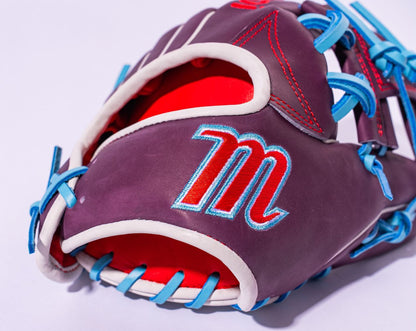 A close-up of the Marucci NightShift Jetski 11.5" Baseball Glove (MFGNTSHFT-0403), crafted from Japanese-tanned steerhide in purple with blue laces, red stitching, a red interior, and a red and white embroidered "M" on the outer side.