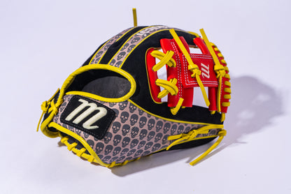 The Marucci NightShift Hot Head 11.5" Baseball Glove (MFGNTSHFT-0406) features black Japanese-tanned steerhide, yellow laces, red accents, small gray skulls, and a white "m" logo on a black patch. Displayed on a white background.