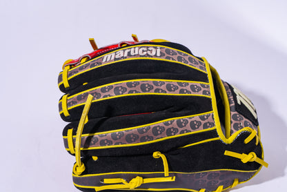 The Marucci NightShift Hot Head 11.5" Baseball Glove (MFGNTSHFT-0406) features a black and yellow design with small black skulls on the fingers and is made from Japanese-tanned steerhide leather, shown against a white background.