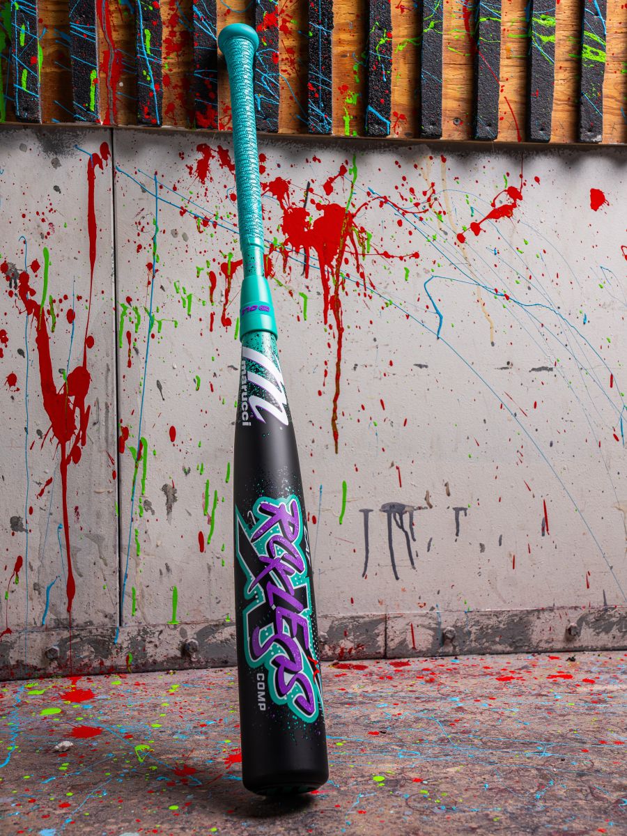 The 2026 Marucci CAT X RCKLESS Composite (-8) USSSA Baseball Bat features a composite barrel and vibrant paint splatters for a bold, eye-catching look.