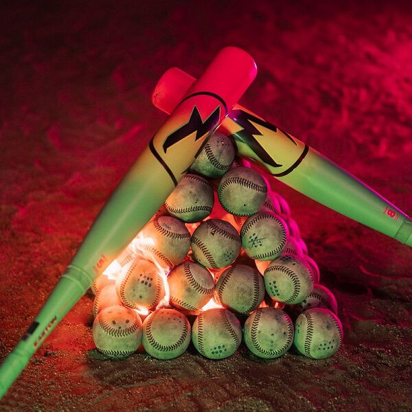 Baseballs and bats, such as the 2026 Easton Hype Fire (-11) 2 5/8" USA Baseball Bat (EUS6HYP11) by Easton, are stacked on top of each other.