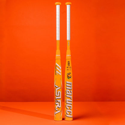 Two Marucci ASURA Glow Citrus Spark (-10) fastpitch bats with white handles stand upright against an orange background. Featuring bold white and blue logos, they showcase innovative Gap Sync Barrel Technology for performance.