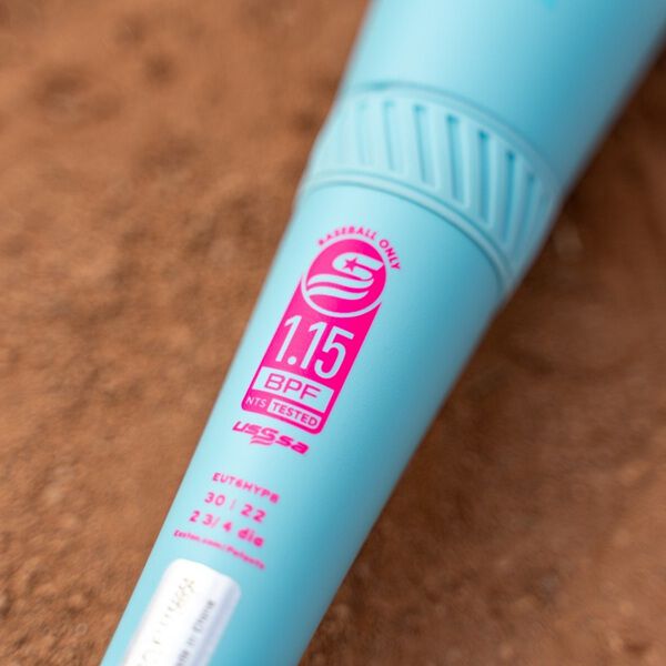 Close-up of a 2026 Easton Hype Fire (-5) 2 3/4" USSSA Baseball Bat (EUT6HYP5) with ThermoComposite technology, lying on dirt and showing the pink and white 1.15 BPF label and -5 specifications.