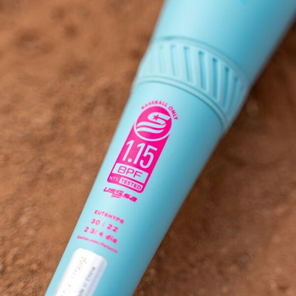 Close-up of a 2026 Easton Hype Fire (-5) 2 3/4" USSSA Baseball Bat (EUT6HYP5) with ThermoComposite technology, lying on dirt and showing the pink and white 1.15 BPF label and -5 specifications.