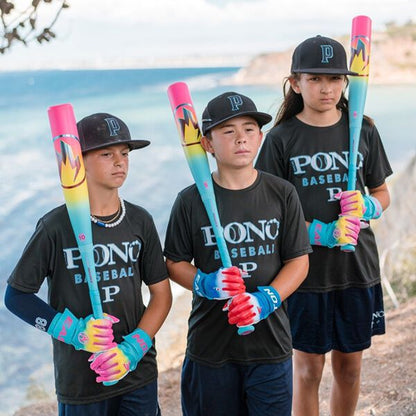 Three young baseball players in matching PONO BASEBALL gear hold colorful bats, including the 2026 Easton Hype Fire (-5) USSSA Baseball Bat, as they pose outdoors with the ocean and cliffs in the background.