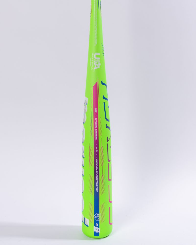 The Marucci 2027 RCKLESS Gen 2 USA Baseball Bat stands upright on a plain white background, showcasing its neon green alloy construction with white and blue text and featuring advanced anti-vibration technology for enhanced comfort and performance.