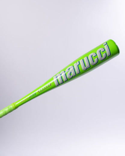 A vibrant green Marucci 2027 RCKLESS Gen 2 USA Baseball Bat, featuring striking white and blue lettering, is displayed on a light gray background; it’s engineered as a premium USA baseball bat with advanced anti-vibration technology.