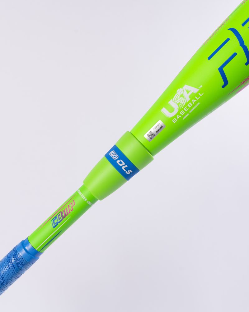 A close-up of the Marucci 2027 RCKLESS Gen 2 Composite (-10) USA Baseball Bat (MSBRC210U), featuring neon green and blue colors with “USA Baseball,” “COMPX,” and “DLS” printed on it. The bat has a textured blue grip, set against a light gray background.