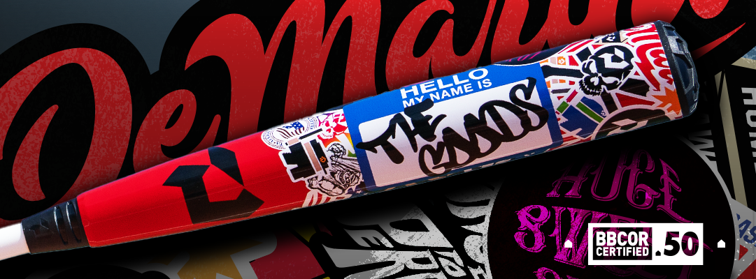 A baseball bat covered in colorful graffiti-style stickers, including a large Hello my name is label with THE GOODS written on it, lying on a background with bold text and sticker designs.