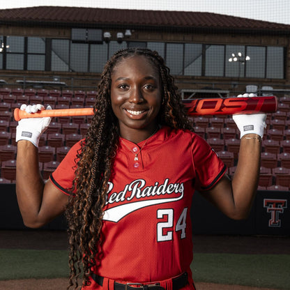 A woman holding the 2026 Easton Ghost Advanced (-10) Fastpitch Softball Bat (EFP6GHAD10) featuring Double Barrel construction.