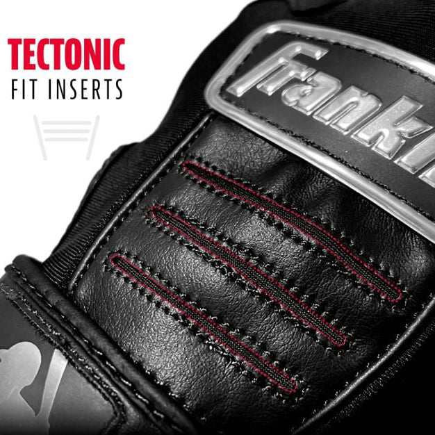Close-up of a black Franklin sports glove with red stitching. Text on the left reads Tectonic Fit Inserts in bold red and black letters, and the MLB logo is partially visible at the bottom left.