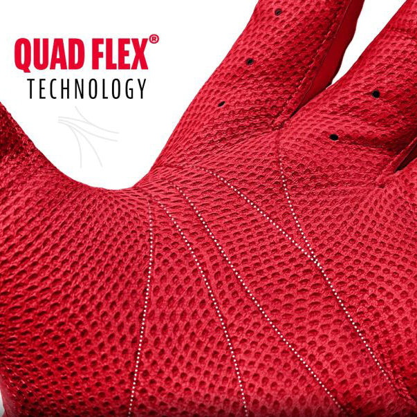 A close-up of a red glove with textured material and dotted lines on the palm, showcasing QUAD FLEX TECHNOLOGY written in bold red and black text in the upper left corner.