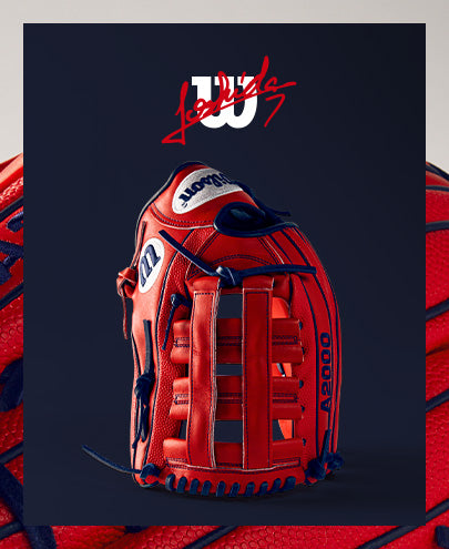 A Wilson A2000 MY7 12.5" Masataka Yoshida GM baseball glove (WBW102529125) is displayed on a blue background, highlighting Wilson's renowned craftsmanship and quality.