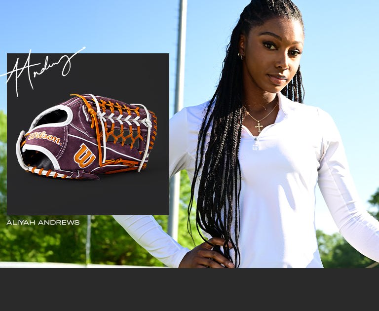 A woman with braids, in a white shirt and a Wilson A2000 T125 12.5" Aliyah Andrews GM Fastpitch Glove (WBW102745125), channels Aliyah Andrews' style.