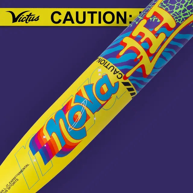 A colorful yellow and blue baseball bat with Nova and CAUTION lettering, featuring bold graphics and a Victus logo on a caution tape-like banner at the top against a purple background.