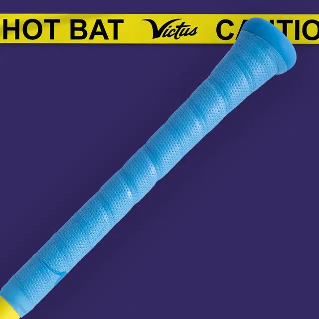 A blue baseball bat handle is angled across a purple background, with yellow caution tape reading HOT BAT and CAUTION at the top. The word Victus appears in black script on the tape.