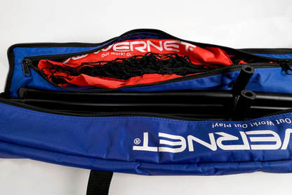 A blue PowerNet 7' x 7' Deluxe Replacement Carry Bag, partially open to show red fabric, black netting, and metal poles inside, features the white VERNET logo—perfect for carrying your hitting or replacement net.
