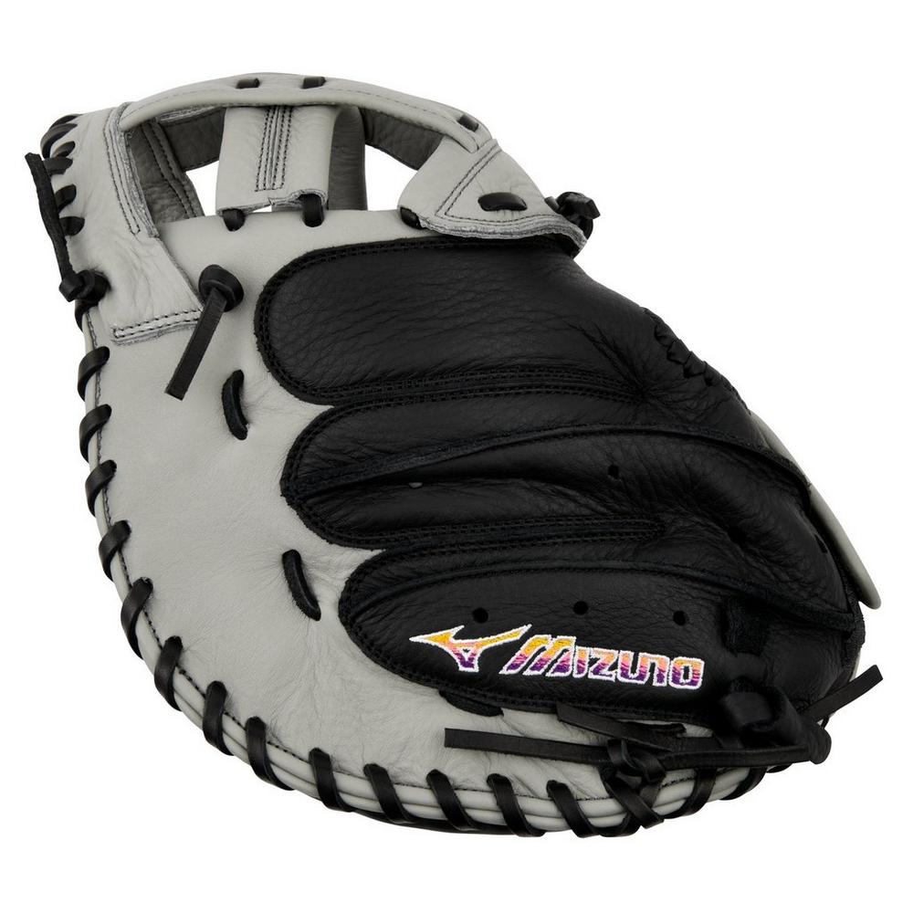 The Mizuno Franchise 34" Fastpitch Catcher's Mitt (GXS90F5) features a black and gray design with full-grain leather, black lacing, and the Mizuno logo stitched near the thumb area.