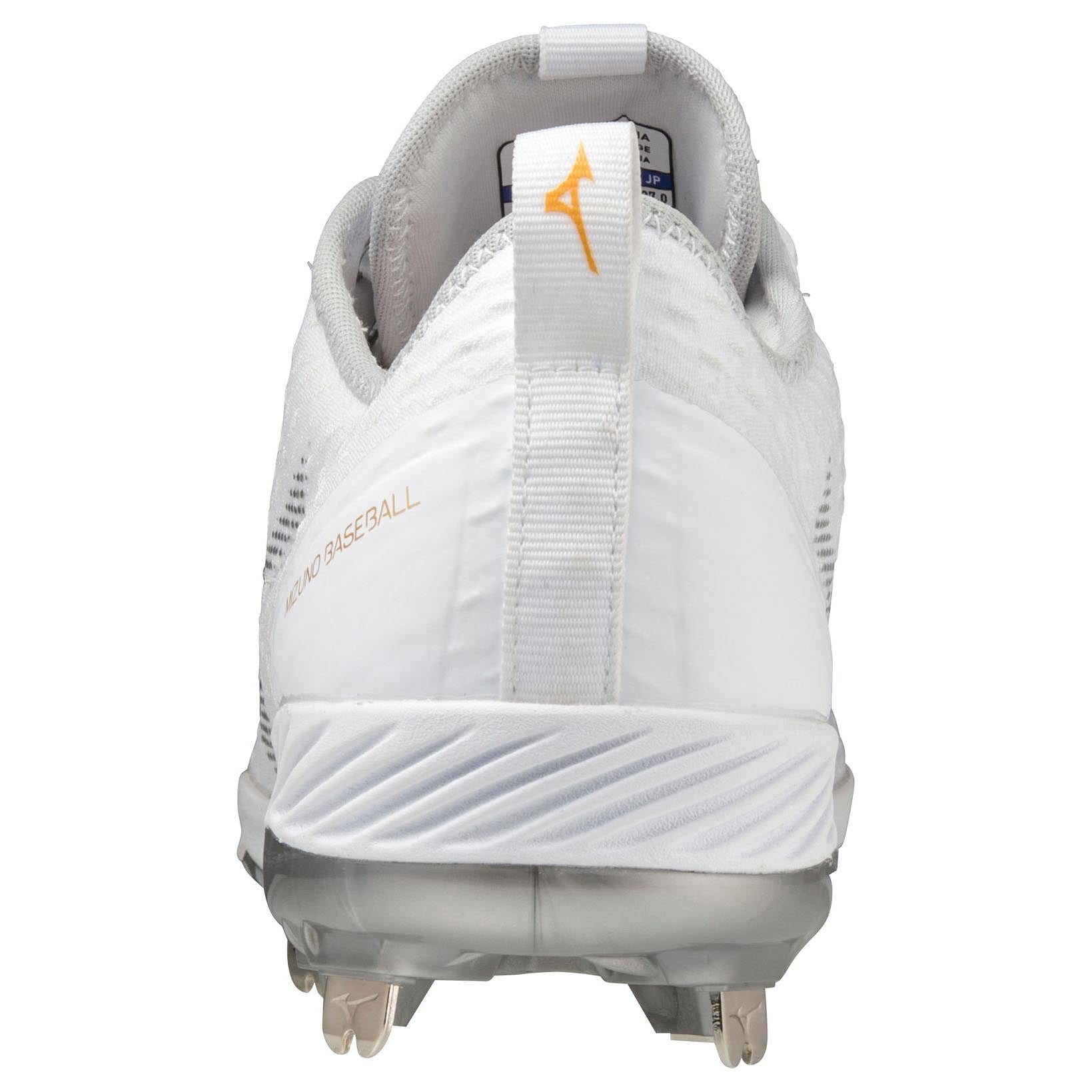 Rear view of Mizuno Dominant 4 Men's Metal Baseball Cleats (320667) with a white woven knit upper, gray sole, silver metal spikes, heel pull tab with gold logo, and "WORLD BASEBALL" text on the side. Brand: Mizuno.