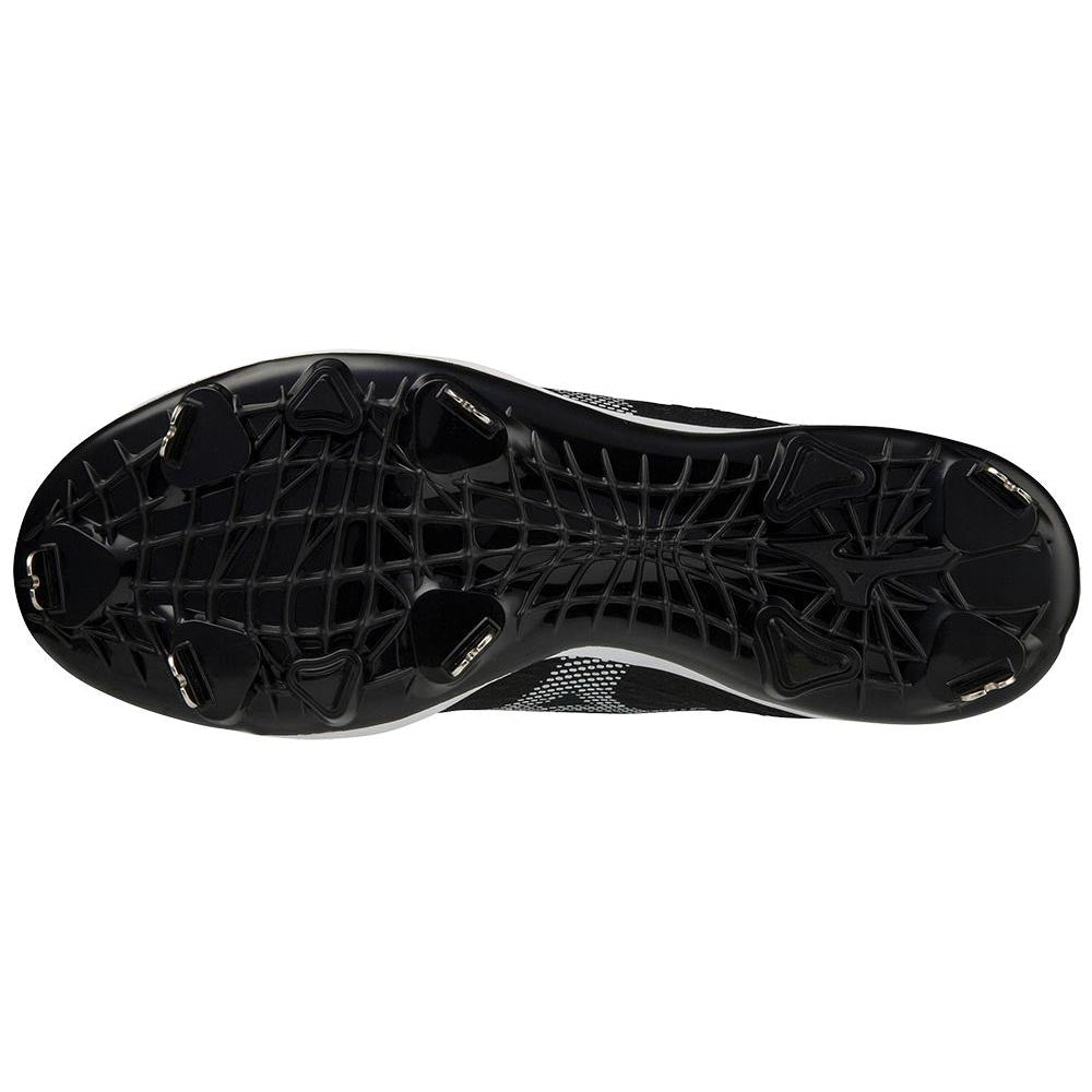 Bottom view of Mizuno Dominant 4 Men's Metal Baseball Cleats (320667) showing six metal studs and a web-like textured sole pattern, highlighting the signature design from Mizuno.