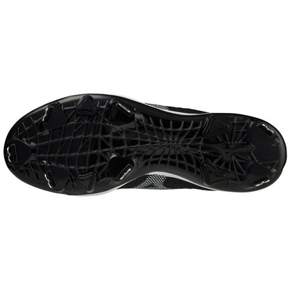 Bottom view of Mizuno Dominant 4 Men's Metal Baseball Cleats (320667) showing six metal studs and a web-like textured sole pattern, highlighting the signature design from Mizuno.