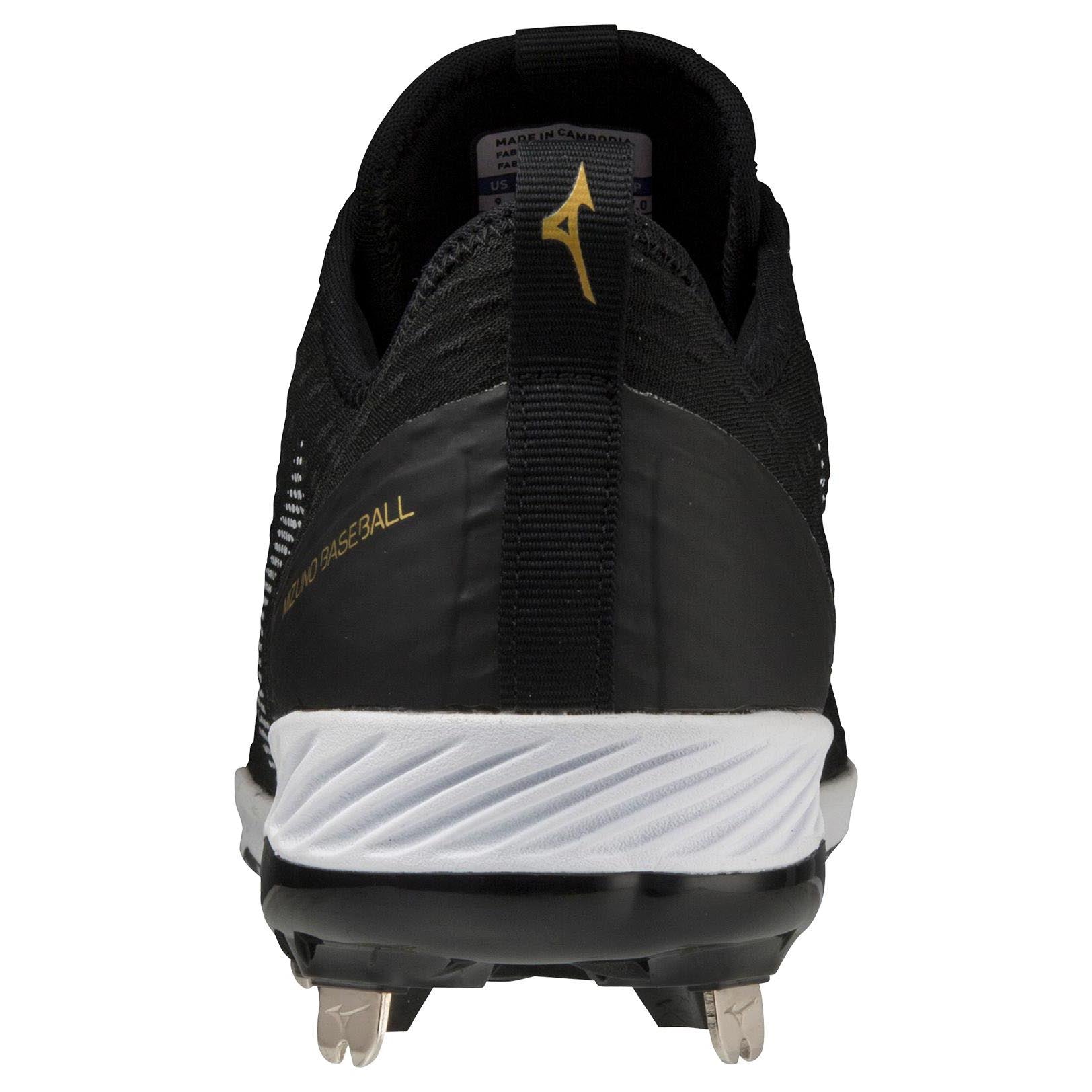 Rear view of black Mizuno Dominant 4 Men's Metal Baseball Cleats (320667) with a woven knit upper, white sole, silver metal spikes, gold Mizuno logo, and "MIZUNO BASEBALL" lettering on the side.