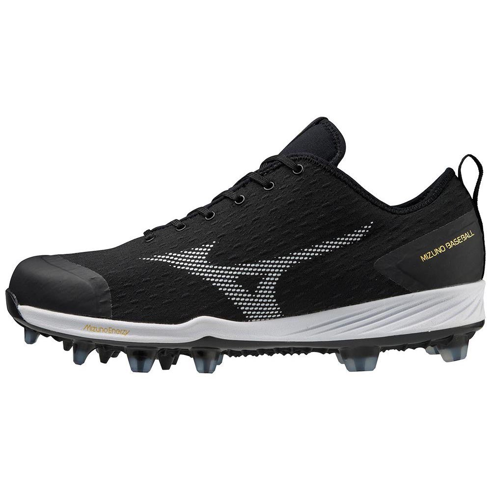 The Mizuno Dominant 4 Men's TPU Molded Baseball Cleats (320670) feature a black upper, white sole, black laces, and a white Mizuno logo on the side. "Mizuno Baseball" appears in gold near the heel. These cleats have TPU molded studs instead of metal spikes.