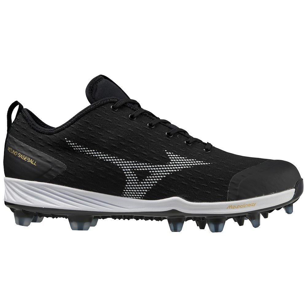 The Mizuno Dominant 4 Men's TPU Molded Baseball Cleats (320670) feature a black and white design with white accents, a prominent Mizuno logo on the side, and molded studs for superior traction.