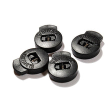 Four All Star GloveLock devices (GL-4PACK), in black with grooves and spring mechanisms, are arranged on a white surface. Each secure lace locker is embossed with GLOVELOC, designed to keep gloves tight and secure during wear.