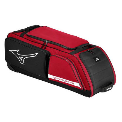 The Mizuno Samurai Wheeled Catcher's Bag: 360327 is a large red-black Mizuno bag with a white logo, side compartments, and "Samurai" on the side—rectangular and ideal for carrying catcher's gear like Mizuno Pros.