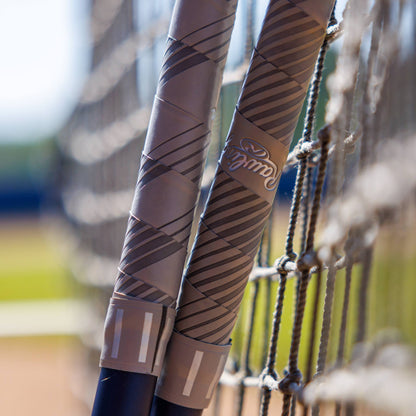 A close-up of the 2025 Rawlings Mantra (-10) Fastpitch Softball Bat: RFP4M10 (DEMO) highlights its sleek Rawlings grip and detailed design.