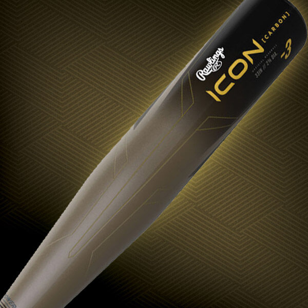 Close-up of a black Rawlings ICON baseball bat with gold lettering and geometric designs, showing the brand name, model, and the word carbon on a patterned background.