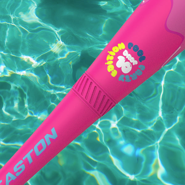 A pink object in water floats gracefully, much like the vibrant 2025 Easton Hype Fire Pool Party (-8) USSSA bat, known for its striking color and sleek Easton design.