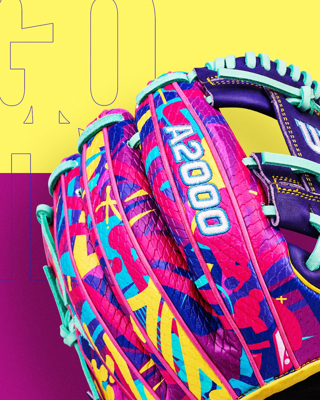 A close-up of the Wilson A2000 1786SS 11.5" Baseball Glove (GOTM January 2026), crafted from Pro Stock leather and featuring a colorful pink, blue, yellow, and purple design against a vibrant yellow and purple background.