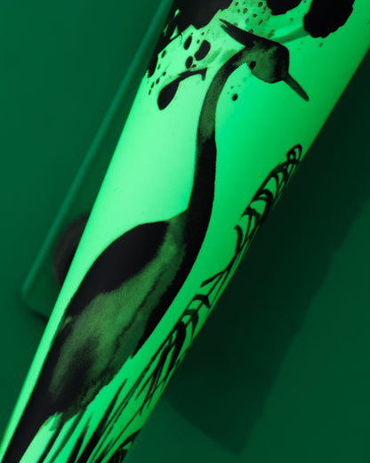 A close-up of a heron with long legs and neck, painted in black ink on light green with abstract plants and splatters, echoes the dynamic energy found in the DeMarini 2026 Exile Samurai (-3) BBCOR Baseball Bat (WBD2652010).