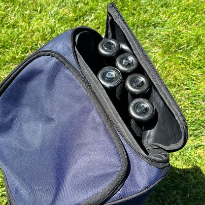 A partially open Champro Sports Champro Boss Wheeled Catcher's Bag: E92 sits on grass, showing the handles of several baseball or softball bats inside.