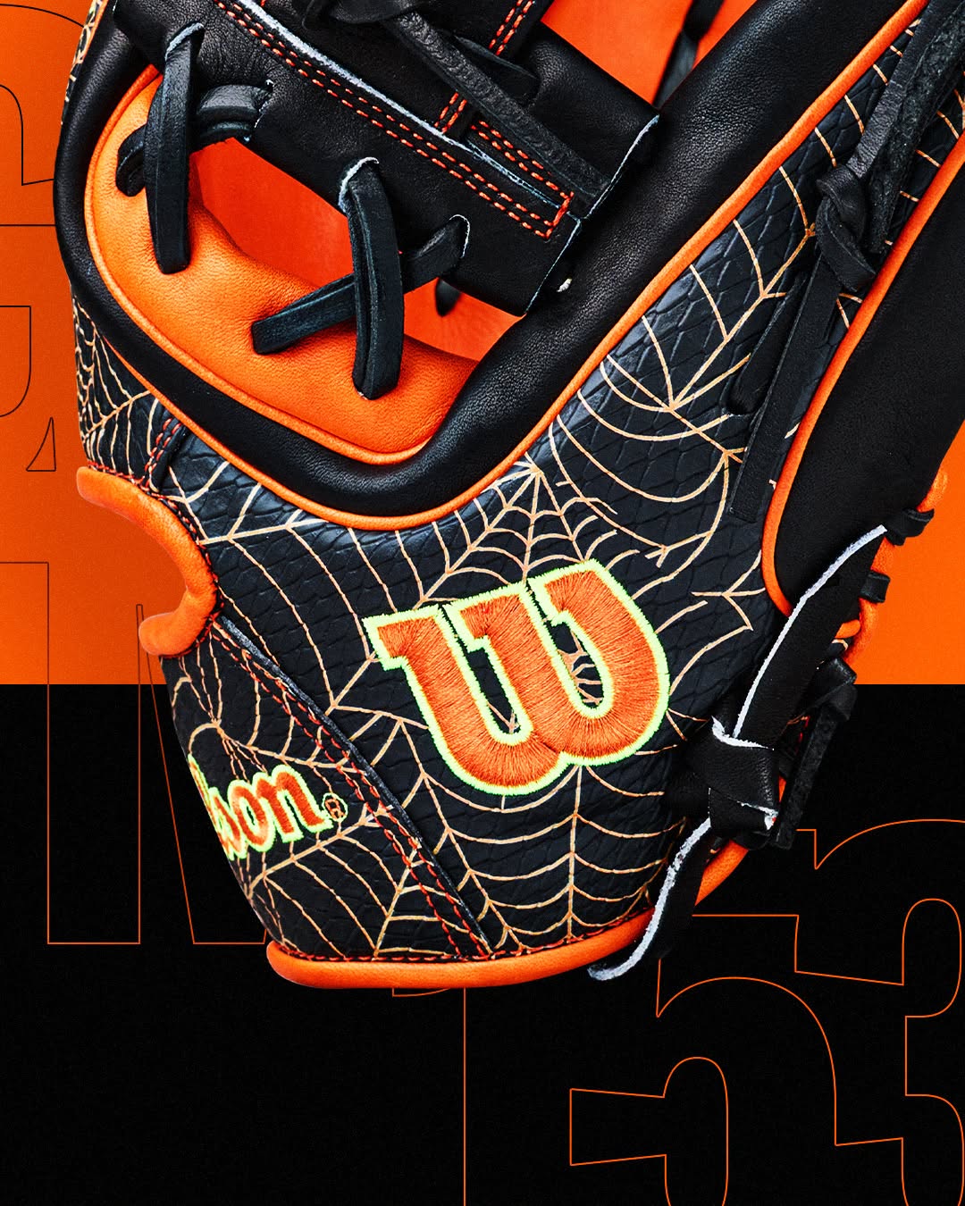 Wilson A2000 1720SS 11.5″ Baseball Glove - GOTM October 2026: WBG31001RT115 in black and orange, featuring a gold spiderweb pattern and a neon-outlined logo.