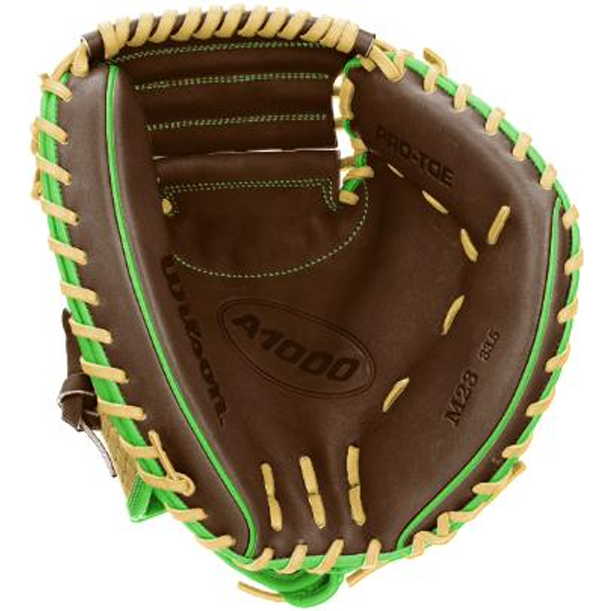 A close-up of a brown Wilson A1000 CM33 DUBAI 33″ Baseball Catcher’s Mitt (WBG25101RT33) youth glove with green and tan lacing, showing the inside pocket and featuring the Wilson brand.